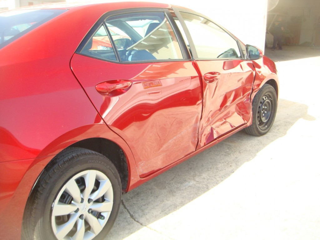 Photographs of a damaged red Toyota Corolla that was repaired by Elite Paint & Body Shop in West Palm Beach Florida