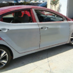 Before and after photographs of a damaged Hyundai Elantra that was repaired by Elite Paint & Body Shop