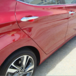 Before and after photographs of a damaged Hyundai Elantra that was repaired by Elite Paint & Body Shop