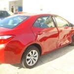 Before and after photographs of a damaged Red Toyota Corolla that was repaired by Elite Paint & Body Shop in West Palm Beach, Florida.