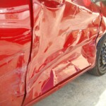 Before and after photographs of a damaged Red Toyota Corolla that was repaired by Elite Paint & Body Shop in West Palm Beach, Florida.