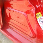 Before and after photographs of a damaged Red Toyota Corolla that was repaired by Elite Paint & Body Shop in West Palm Beach, Florida.