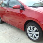 Before and after photographs of a damaged Red Toyota Corolla that was repaired by Elite Paint & Body Shop in West Palm Beach, Florida.
