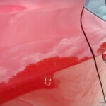 Before and after photographs of a damaged Red Toyota Corolla that was repaired by Elite Paint & Body Shop in West Palm Beach, Florida.