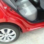 Before and after photographs of a damaged Red Toyota Corolla that was repaired by Elite Paint & Body Shop in West Palm Beach, Florida.