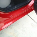 Before and after photographs of a damaged Red Toyota Corolla that was repaired by Elite Paint & Body Shop in West Palm Beach, Florida.