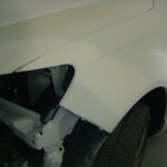 Before and after photographs of a damaged white, AUDI Quattro SUV that was repaired by Elite Paint & Body Shop in West Palm Beach, Florida.