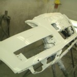 Before and after photographs of a damaged white, AUDI Quattro that was repaired by Elite Paint & Body Shop in West Palm Beach, Florida.