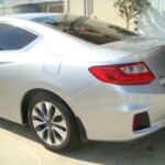 Before and after photographs of a damaged, silver, Honda Accord that was repaired by Elite Paint & Body Shop in West Palm Beach, FL.
